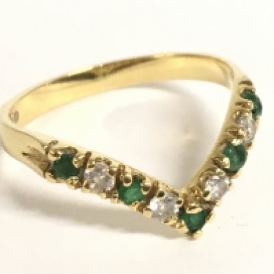 An 18ct gold emerald wishbone ring, size O. 2.5g Postage category a