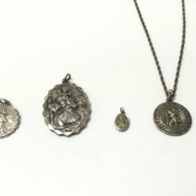A collection of silver pendants. 45.95g Postage A
