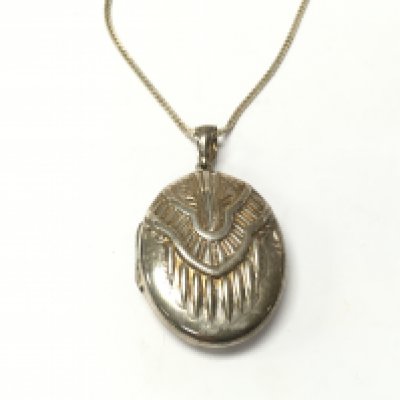 A silver locket on a silver chain. 27.11g total.