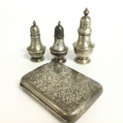 A silver hallmarked cigarette case and silver hallmarked pepper pots. Postage category B
