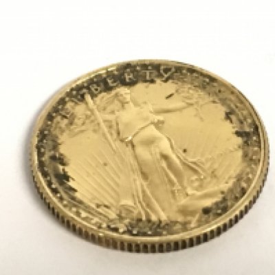 A 22 carat gold American Eagle 1/10 ounce coin