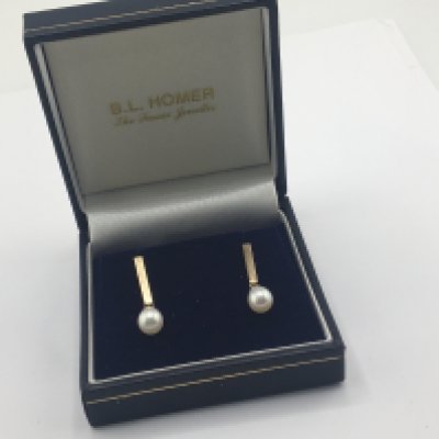 A pair of 9carat gold and cultured pear earrings with vertical drop and pear shaped pearl in a fitted box