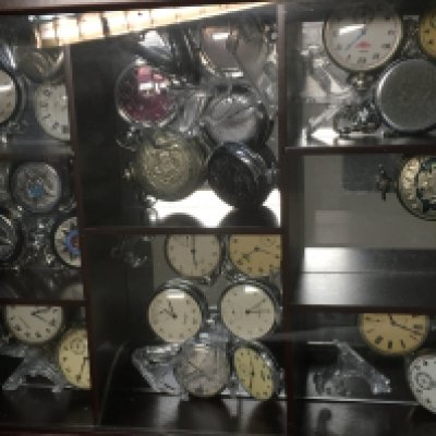 A case containing various vintage pocket watches including Soviet Russian examples such as Molnija, Sekonda, Regus etc. This lot cannot be posted