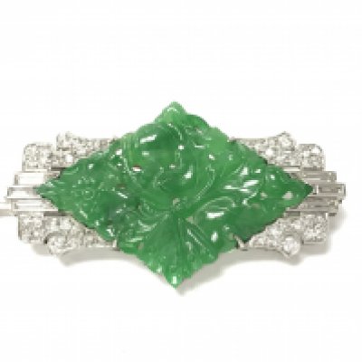 A quality 1920s platinum Art Deco brooch set with diamonds and imperial green jade. Approximately 48mm wide. Postage B