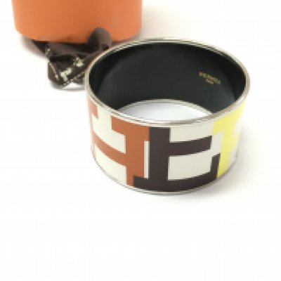 A Hermes multicolour enamel logo and metal bangle with box. Bangle is 35mm wide and 6.5cm diameter.