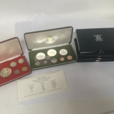 Two cased sets of British Commonwealth coins The Bahamas Trinidad and Tobago containing some silver coinage other Royal Mint Proof Coin collection annual packs and a set of 1976 Royal Canadian Mint coins.