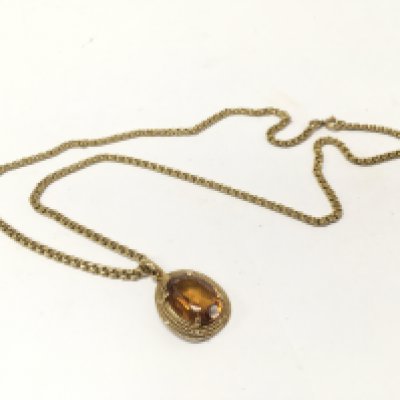 An 18ct gold citrine set pendant and necklace. Approx weight 17.21 grams.
