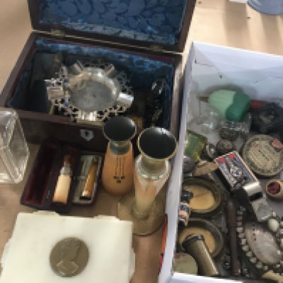 A collection of perfume bottles together with a miniature silver frame, objects of virtue and a rosewood box containing match holders, vest case, gold rim cigar holder and costume jewellery various