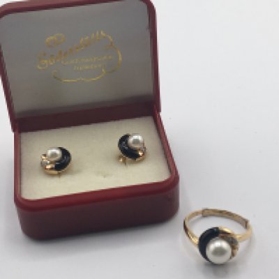 A modern design 18carat gold ring with matching earrings set with pearl and small diamonds.weight 7.5g