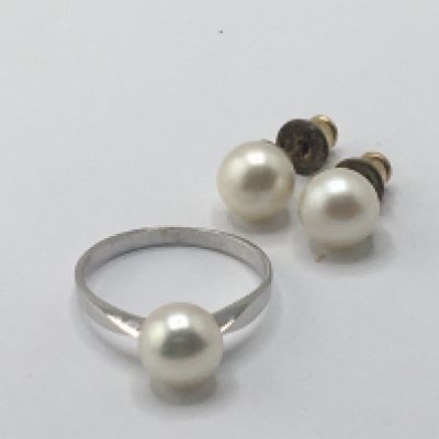 An 18carat white gold ring set with a cultured pearl weight 2g and a pair of pearl earrings.