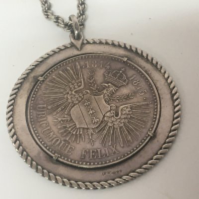A silver Napoleon coin medallion 1814 1815 in a silver pendent mount with attached chain.