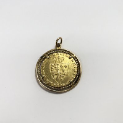 A george III 1798 spade guinea 1798 in an unmarked pendant mount. Approx weight 12.00 grams.