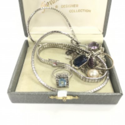 A box containing white metal costume jewellery.
