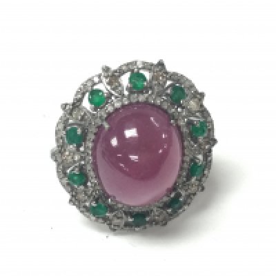 Large dress ring in white metal set with an oval cabochon ruby round emerald and RC diamonds in a stylish box. Ruby 22.35ct emerald 0.85ct and diamonds 0.60ct approximately. Ring size O