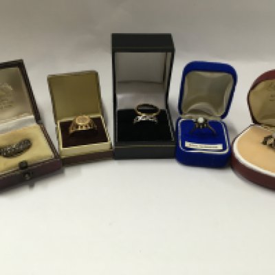 Six rings including gold rings and one platinum.