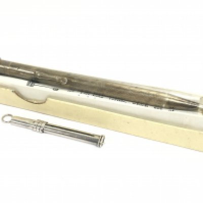 A boxed silver propelling pencil and silver toothpick. Postage category A