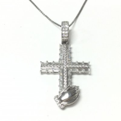 A silver cross pendant with praying hands set with round and baguette cut white CZ on a silver chain. Postage A