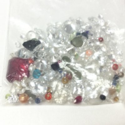 A parcel of gemstones and beads including rhinestone cubic zirconia etc over 100ct total. Postage A