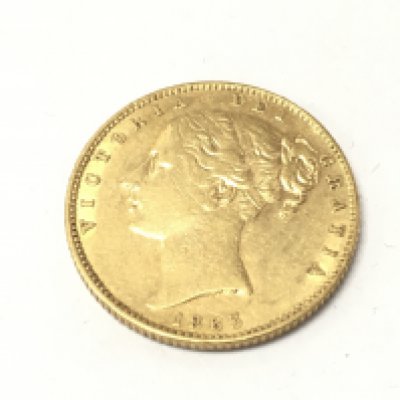 A 1863 shield back sovereign. Postage A