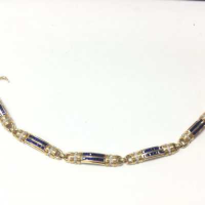 An 18ct yellow gold step cut sapphire and diamond panel bracelet. Sapphires 2.50ct and diamonds 0.40ct approx. Comes with cert.