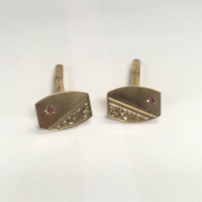 A 9ct gold ruby set pair of cufflinks. Approx 9.00 grams.
