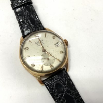 1960 Doyle 18ct gents wrist watch. Postage category A.