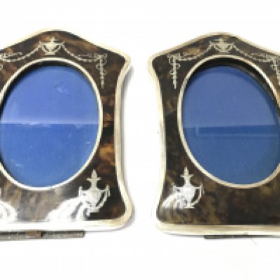A pair of tortoise shell and silver frames. Birmingham hallmark 1909. 22cm by 16cm