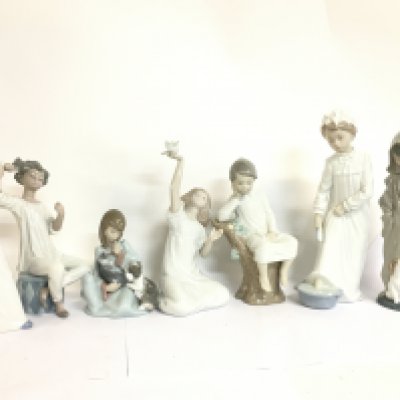 A collection of porcelain Lladro figures , 15 to 30cm tall. this lot cannot be posted