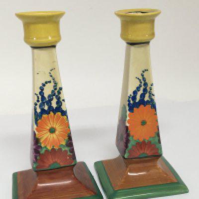A Quality pair of Clarice Cliff GayDay pattern candle sticks no obvious damage or restoration height 21cm. Slight variation in the colour brown. (2)