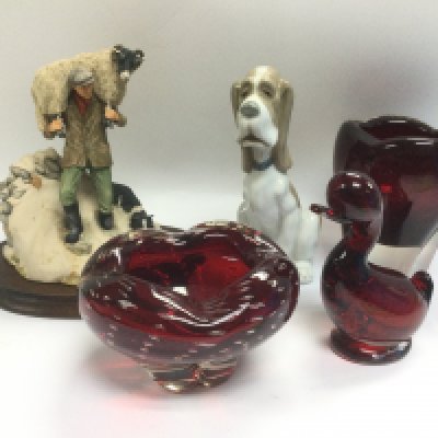 A Border Fine Arts figural group from The James Herriot collection by Anne Butler, a Nao figure of a dog and three ruby glass items (5). Shipping category D.