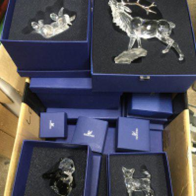 A collection of boxed Swarovski items. Shipping category D.