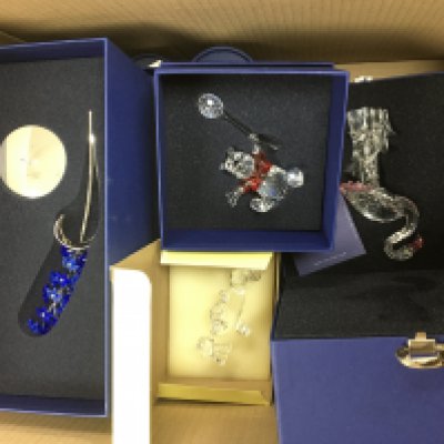 A collection of mainly boxed Swarovski items including Winnie The Pooh and Disney characters. Shipping category D.