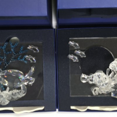 Four boxed Swarovski Wonders of the Sea ornaments, some damage, plus smaller related boxed Swarovski (7). Shipping category D.