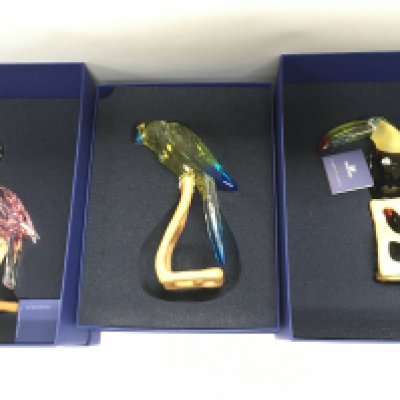 Eight boxed Swarovski birds. Shipping category D.