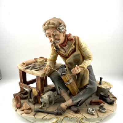 2 large capodimate porcelain figures.