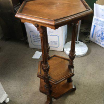 A Victorian three tier table with hexagonal top and fluted column supports, approx height 77.5cm. Shipping category D.