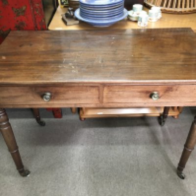 A William IV mahogany side table fitted with two drawers 53x105x76cm