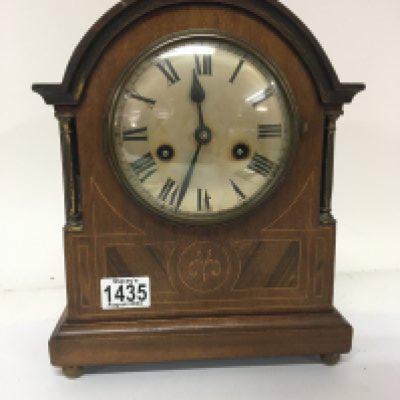 An Inlaid Edwardian mantel clock with brass pillar supports height 31cm. NO RESERVE