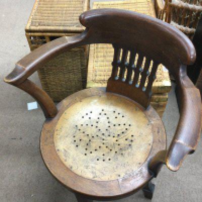An oak early 20th century open arm chair , 83cm tall, 63cm wide