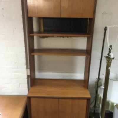A modern teak unit with open shelves 200cm tall, 76cm wide, 46cm long.