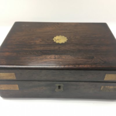 An unusual rosewood writing top and brass bound box. Approximately 24cm wide and 18cm deep. Postage B. NO RESERVE