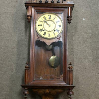A Continental wall clock with inlaid and carved wood design. Dimensions approximately 16x38x100cm. NO RESERVE