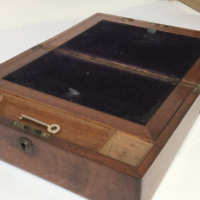 A straight grain walnut writing box with a well fitted interior.