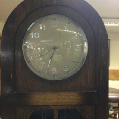 A oak three train longcase clock the circular dial with Arabic numerals.