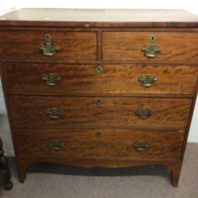 An Early Victorian mahogany chest of drawers the rectangular top above two short and three long drawers on bracket feet.
