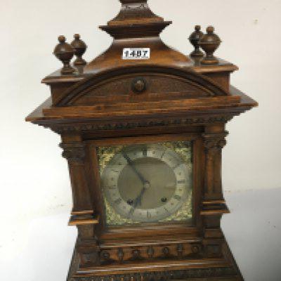 A Quality walnut boardroom or large mantel clock with a silvered dial. 56cm high.