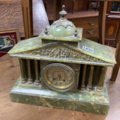 An Onyx and brass classical style mantle clock. Postage not available for this lot.