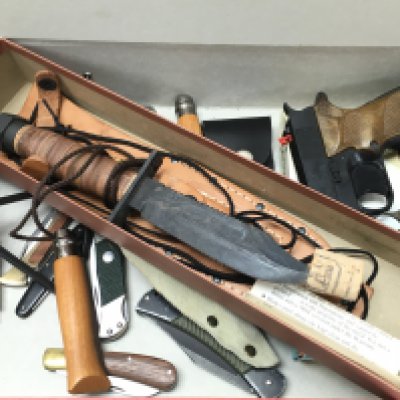 A collection of vintage knives including a boxed Camillus Air Force Pilot Survival knife,