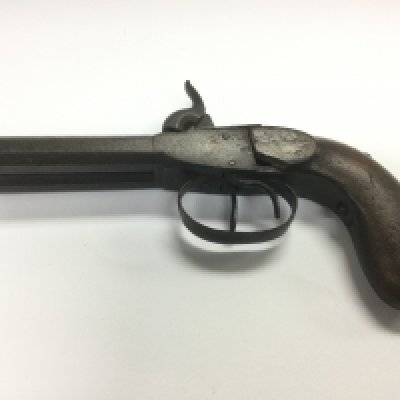 An antique double barrel pistol. Shipping category D.