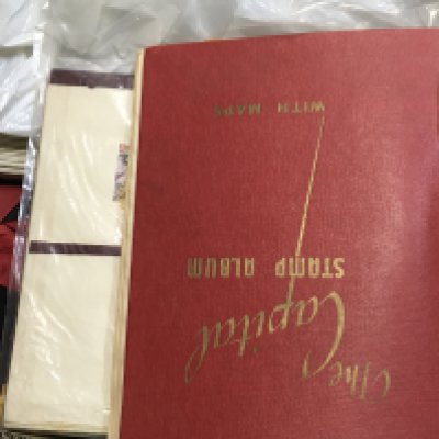 A box of loose stamps, including a world stamp album. Postage category C. NO RESERVE